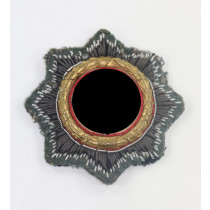 Deutsches Kreuz in Gold auf Heeresstoff, Hst. HS (Hermann Schmuck & Cie., Weißenburg)