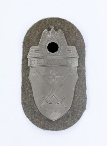 Demjanskschild auf Heeresstoff, Typ 4.5 (Eisen) - Militaria-Berlin