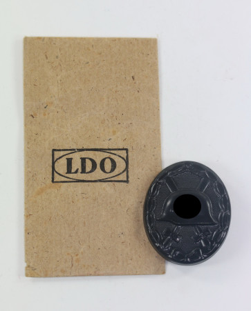 Verwundetenabzeichen in Schwarz 1939, Hst. 4, in LDO Verkaufstüte - Militaria-Berlin