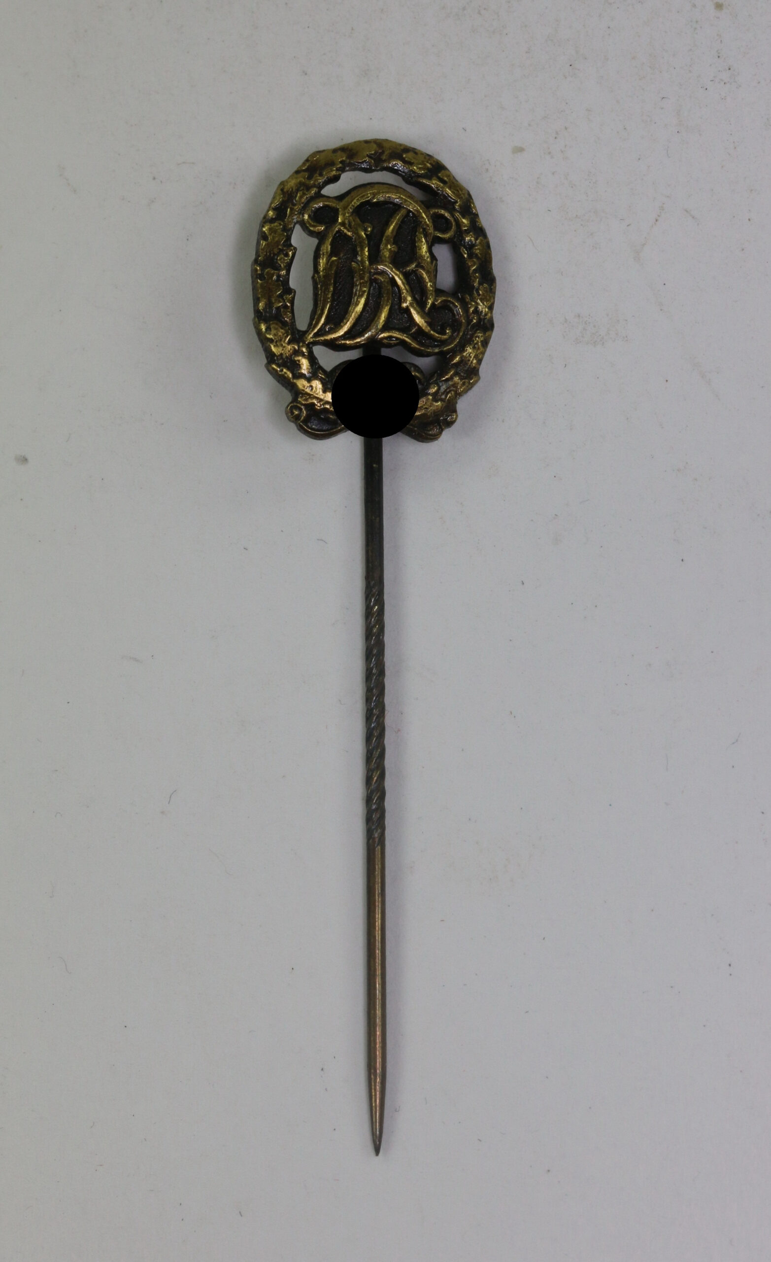  16 MM Miniatur Reichssportabzeichen in Bronze, Hst. E.L.M. – Bild 1