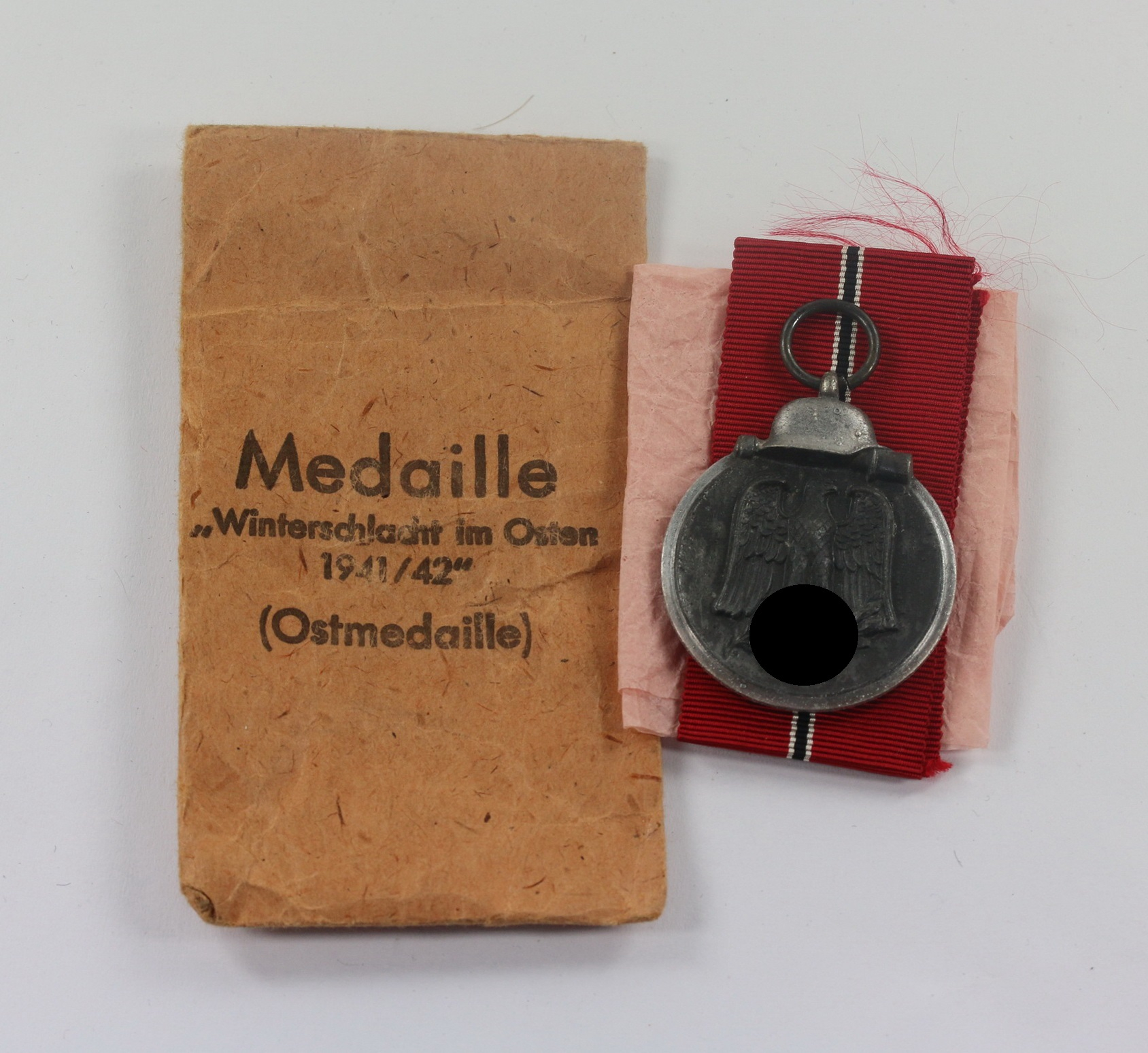 ostmedaille_hst Ostmedaille, Hst. 65, in Verleihungstüte Klein & Quenzer A.G. Oberstein – Bild 1