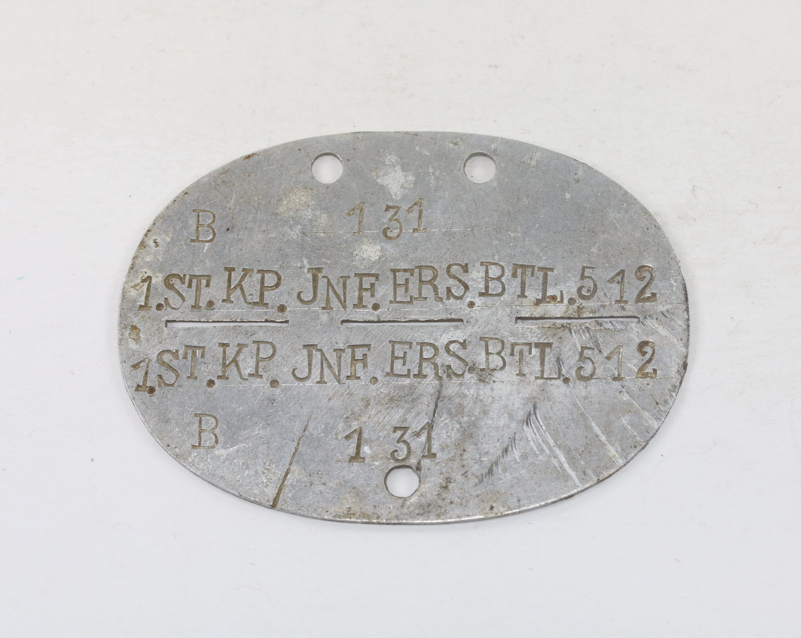 Wehrmacht Heer, Erkennungsmarke 1. St.Kp. JNF. Ers. Btl. 512 (1. Stammkompanier Infanterie Ersatz Bataillon 512 (Aluminium) – Bild 1