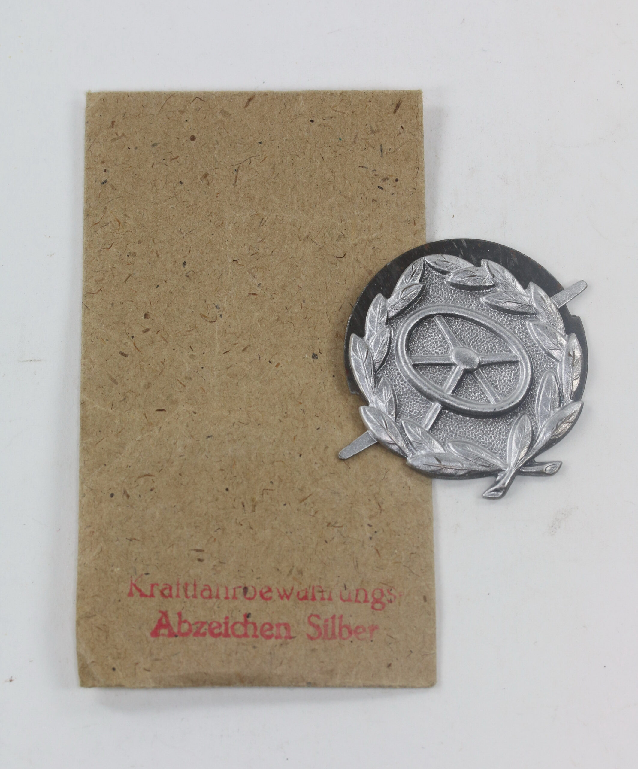  Kraftfahrerbewährungsabzeichen in Silber, in Verkaufstüte Rudolf Souval, Wien 62/VII – Bild 1