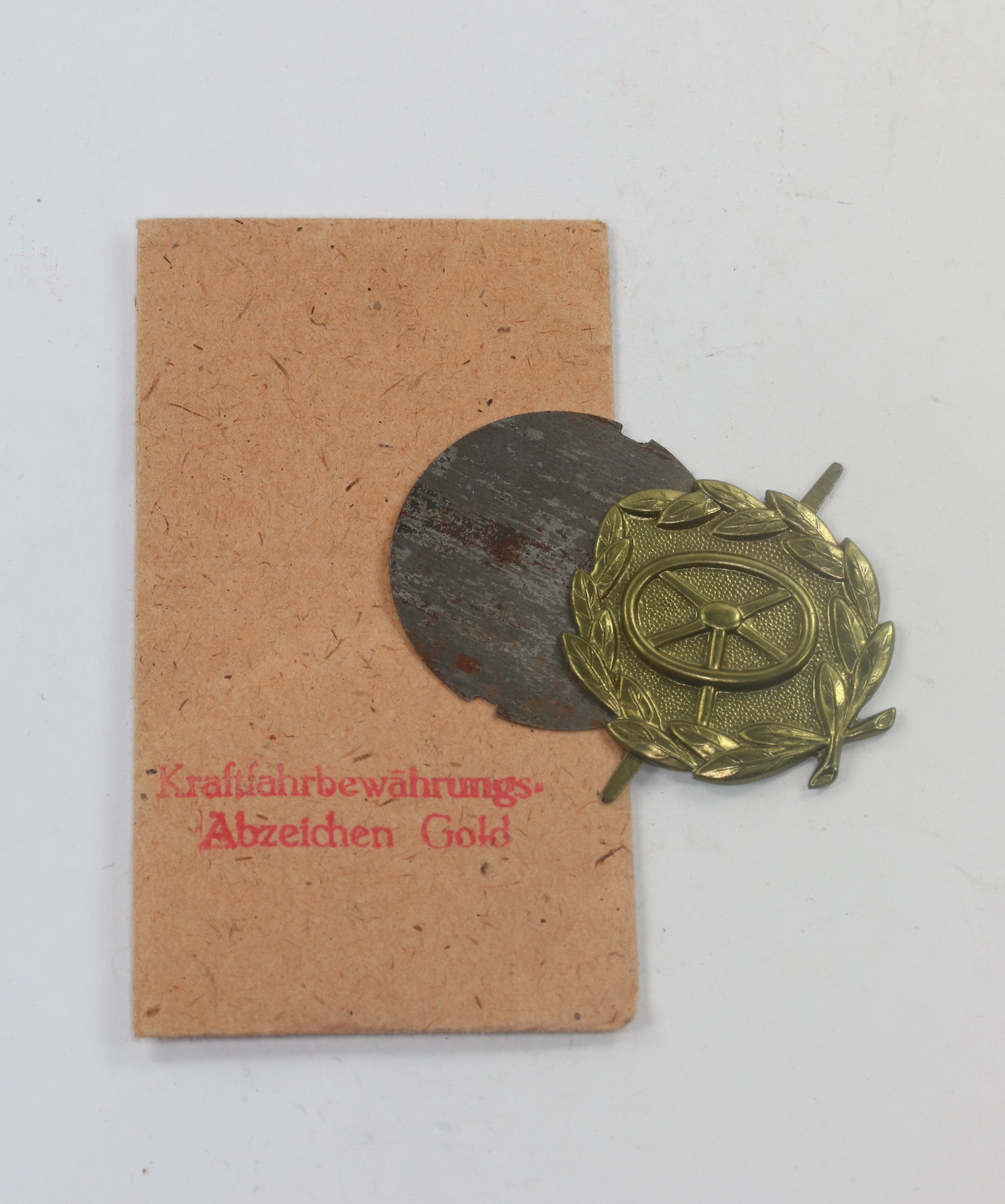  Kraftfahrerbewährungsabzeichen in Gold, in Verkaufstüte, Rudolf Souval Wien VII – Bild 1