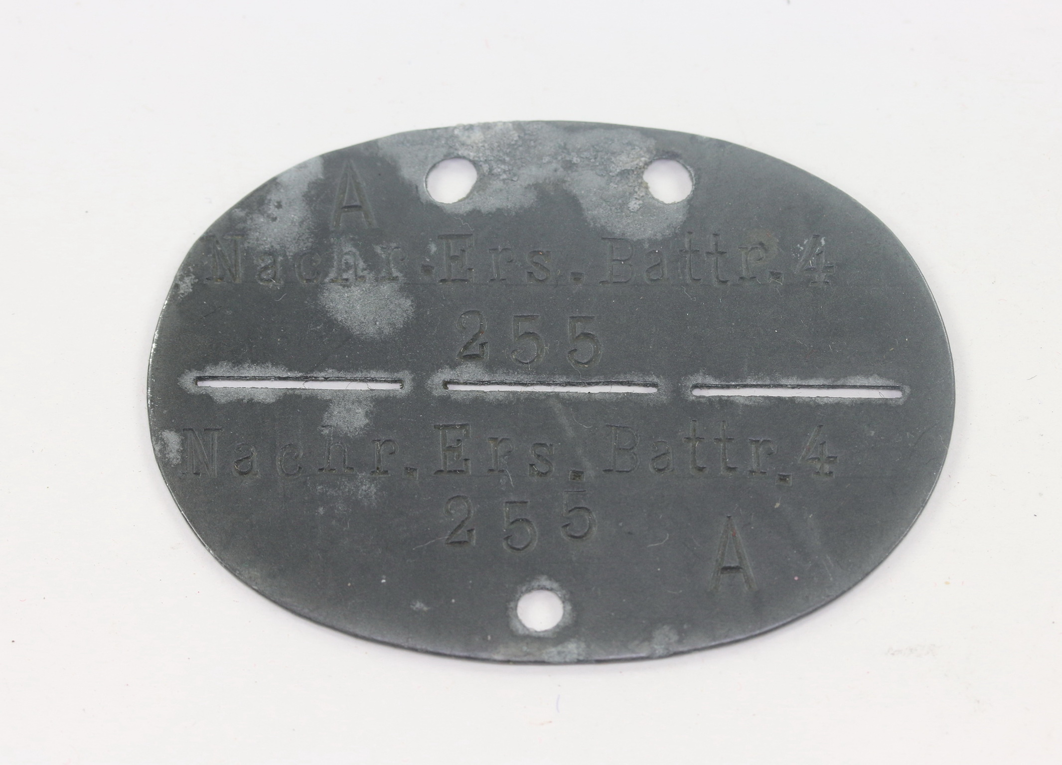 Wehrmacht Heer, Erkennungsmarke Nachr. Ers. Battr. 4 (Nachrichten Ersatz Batterie 4) – Bild 1